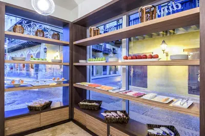 a display case in a store with plates and bowls at NH Royal Urban Cartagena in Cartagena de Indias