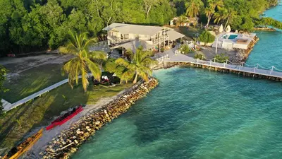 an aerial view of a house next to the water at Quinta del Mar Sunset in Isla Mucura