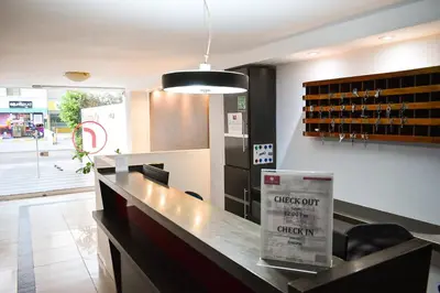 a bar in a restaurant with a sign on a counter at Hotel Or Cartagena in Cartagena de Indias