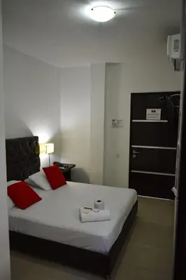 a bedroom with a bed with two towels on it at Hotel Or Cartagena in Cartagena de Indias
