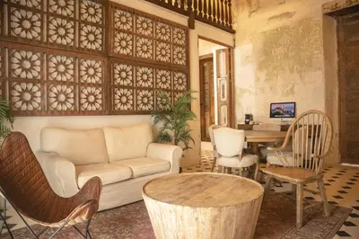 a living room with a couch and chairs and a table at Hotel Casa La Factoria by Faranda Boutique, a member of Radisson Individuals in Cartagena de Indias