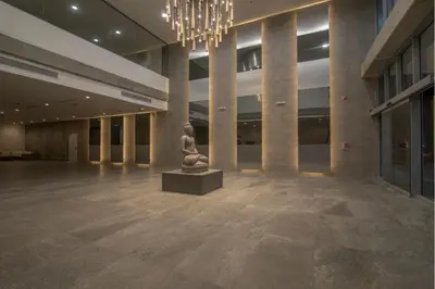 a statue in the middle of a building with a chandelier at Luxury Infinitum in Cartagena de Indias