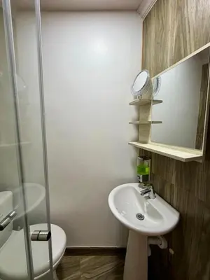 a bathroom with a sink and a glass shower at Palmera Beach in Cartagena de Indias