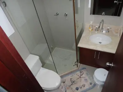 a bathroom with a shower and a toilet and a sink at Morros Vitri Cartagena in Cartagena de Indias