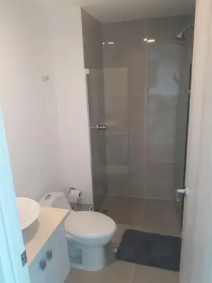 a bathroom with a shower and a toilet and a sink at Apartamento seaway 935 Morros, La Boquilla in Cartagena de Indias