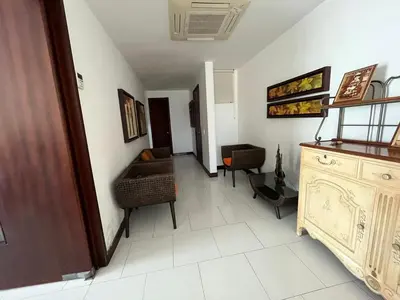a room with a hallway with a couch and a table at Cartagena vista directa al mar amplio apt con terraza privada in Cartagena de Indias