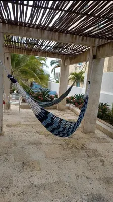 a hammock hanging under a pergola at Cartagena vista directa al mar amplio apt con terraza privada in Cartagena de Indias