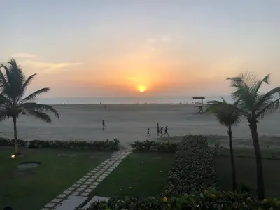 a sunset on the beach with people playing soccer at morros 3 in Cartagena de Indias