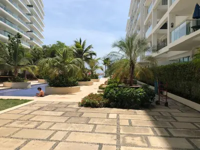 a person sitting in a swimming pool at a resort at morros 3 in Cartagena de Indias