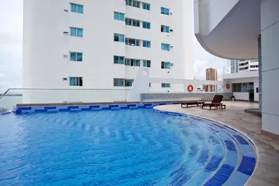 a hotel swimming pool in front of a building at Palmetto Eliptic 4003 in Cartagena de Indias