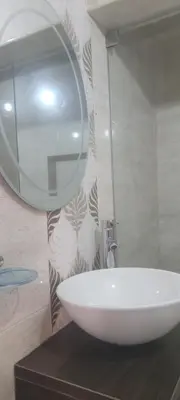 a bathroom with a white sink and a mirror at Casa Fanny in Cartagena de Indias
