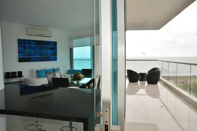 a living room with a view of the ocean at Modern 3 Bedroom Apartment with sea-beach view in Cartagena de Indias