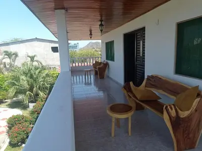 a balcony of a house with a desk and a chalkboard at Villa Las Marias in Santa Veronica