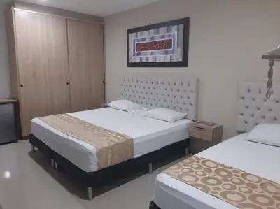 a bedroom with two beds at Genesis Hotel in Sincelejo