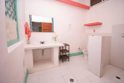 a bathroom with a sink and a toilet at Isla Tijereto in Isla Grande