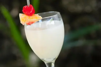 a glass of milk with a strawberry in it at Isla Tijereto in Isla Grande