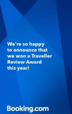 a blue sign that says were so happy to announce that we won a traveller at Casa Anita in Cartagena de Indias