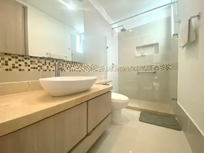 a white bathroom with a sink and a toilet at Apartamento en Cartagena con Vista al Mar in Cartagena de Indias