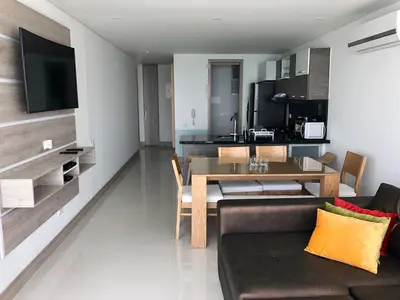a living room with a couch and a dining room at Apartamento en Cartagena con Vista al Mar in Cartagena de Indias