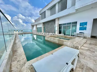 a swimming pool with a view of a building at Apartamento en Cartagena con Vista al Mar in Cartagena de Indias