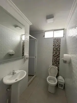 a bathroom with a toilet and a sink at Alojamientos Cartagena Edificio Los Delfines in Cartagena de Indias