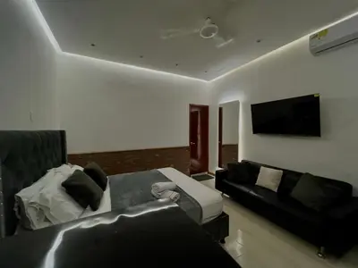a living room with a bed and a couch at Luxury Suite Room in Cartagena de Indias