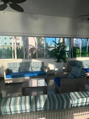 a living room with couches and a couch and a table at Palmetto Suite Superior 3901 in Cartagena de Indias