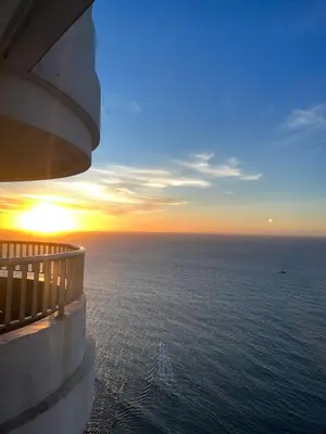 a view of the ocean at sunset from a cruise ship at Palmetto Suite Superior 3901 in Cartagena de Indias
