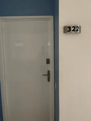 a door with the number on it next to it at Apartamento Confort Frente a la Playa en Cartagena! in Cartagena de Indias