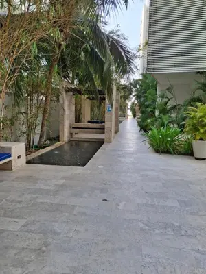 a walkway next to a building with trees at Cartagena Beach Condo - 1400 sq. Ft. (130 m2) in Cartagena de Indias