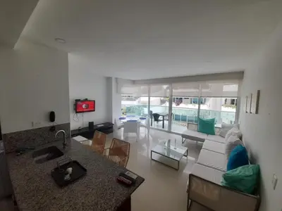 a living room with a couch and a table at Edificio acceso directo al mar primera linea de playa 2 habitaciones in Cartagena de Indias