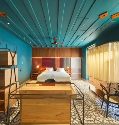 a bedroom with a bed with a blue ceiling at Hotel Boutique Casona del Colegio in Cartagena de Indias