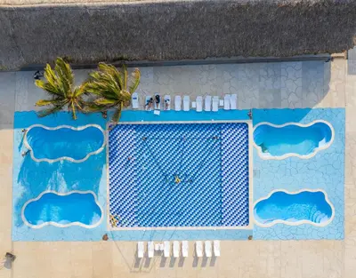 an overhead view of a swimming pool at a resort at Hotel Arena Beach Cartagena in Cartagena de Indias
