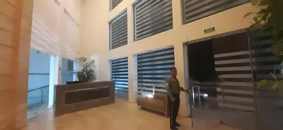 a man standing in the living room of a house at Mi Apartamento en Cartagena in Cartagena de Indias
