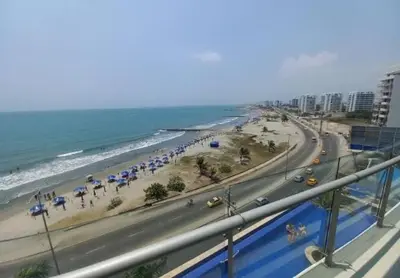 a view of a beach with umbrellas and the ocean at Mi Apartamento en Cartagena in Cartagena de Indias