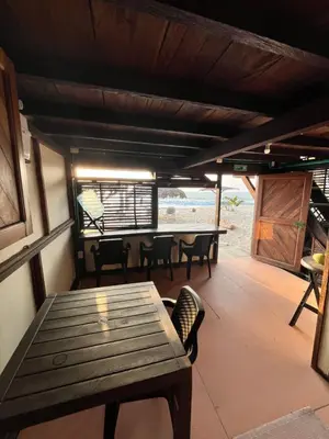 a dining room with a wooden table and chairs at Casa Akira- Rincón del Mar in San Onofre