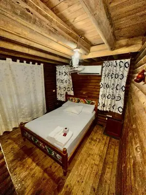a bedroom with a bed in a wooden room at MISTICA Isla Palma in Isla Palma