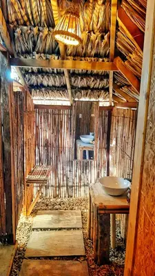an inside view of a hut with a table and a sink at MISTICA Isla Palma in Isla Palma