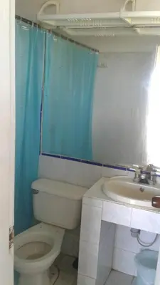 a bathroom with a toilet and a sink at Cabaña Playa De Los Venados in San Bernardo del Viento