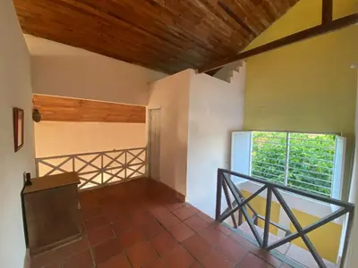 an empty room with a staircase and a window at Cabaña Playa De Los Venados in San Bernardo del Viento