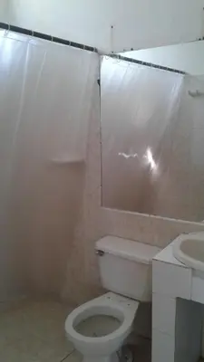a bathroom with a toilet and a sink at Cabaña Playa De Los Venados in San Bernardo del Viento