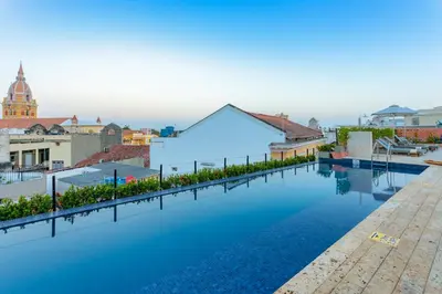 a swimming pool on the roof of a building at Hotel Santa Catalina By OxoHotel in Cartagena de Indias