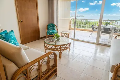 a living room with a couch and a glass table at Hotel Irotama XXI in Santa Marta