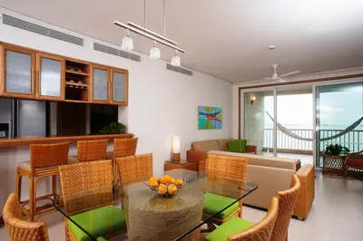 a living room with a table with oranges on it at Hotel Irotama del Mar in Santa Marta