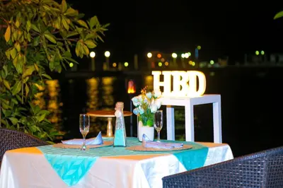 a table with wine glasses and a hfd sign on it at Hotel Isla Palma Reserva Natural in Isla Palma