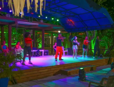 a group of people on a stage at night at Hotel Isla Palma Reserva Natural in Isla Palma