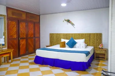 a bedroom with a large bed in a room at Hotel Isla Palma Reserva Natural in Isla Palma