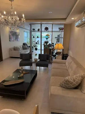 a living room with a couch and a table at Hotel Casa Nico in Barranquilla