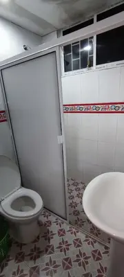 a bathroom with a toilet and a sink at Posada Dakema in Cartagena de Indias
