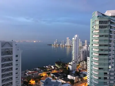 a view of a city with buildings and a body of water at Excelente Apartamento en Murano Elite en Bocagrande, Cartagena in Cartagena de Indias